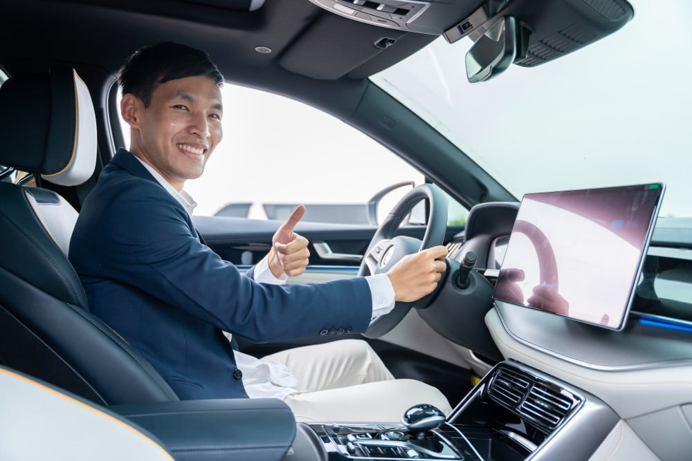 Guys in Car Giving Thumbs Up for Rental